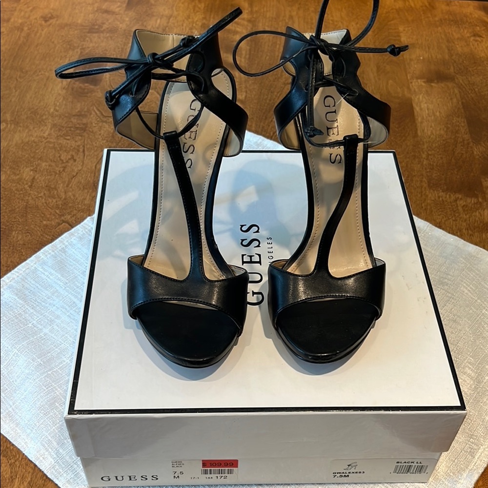 Guess black leather heel with tie and ankle wrap.